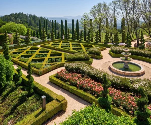 A beautiful landscape in front of a mansion house.